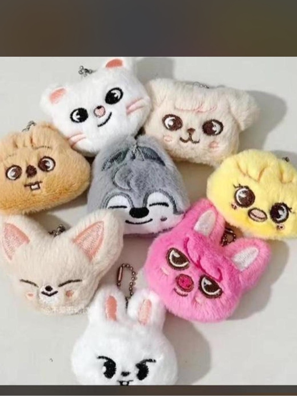 Set of 8 mini plush keychains featuring the faces of the stray kids SKZoo